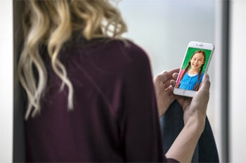 Blonde Girl Using iPhone